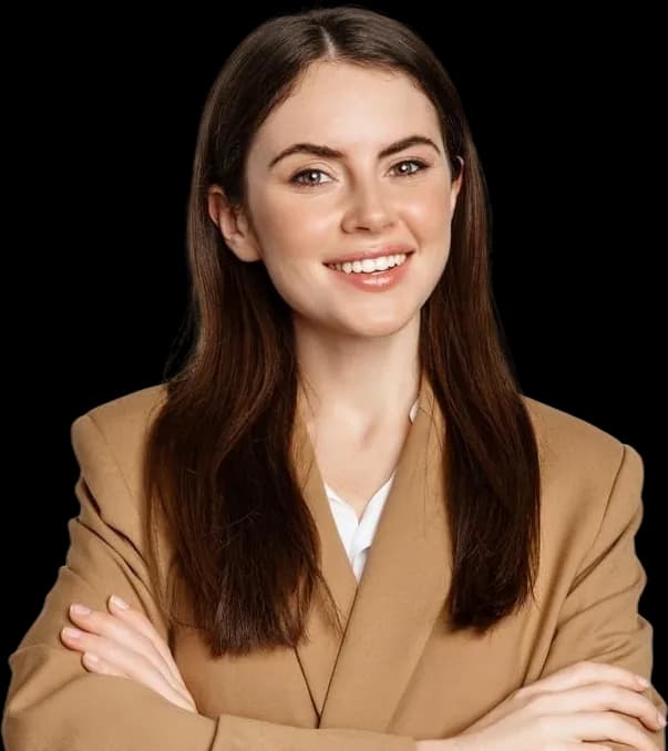 A people-team lead in a camel blazer, arms crossed, smiling